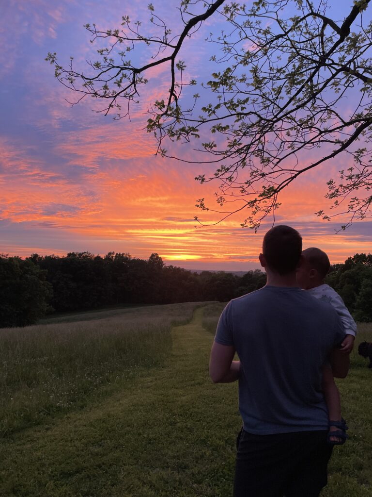 People silhouetted against sunset