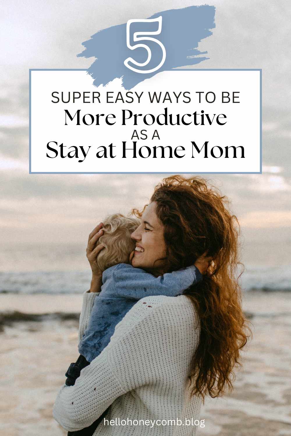 Mother with curly hair holding blonde child a the beach with text overlaid that reads 5 Super Easy Ways to Be More Productive As A Stay at Home Mom