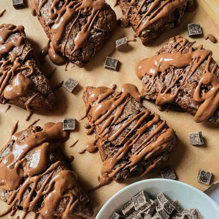 Chocolate sourdough scones drizzled with chocolate glaze and chocolate chunks