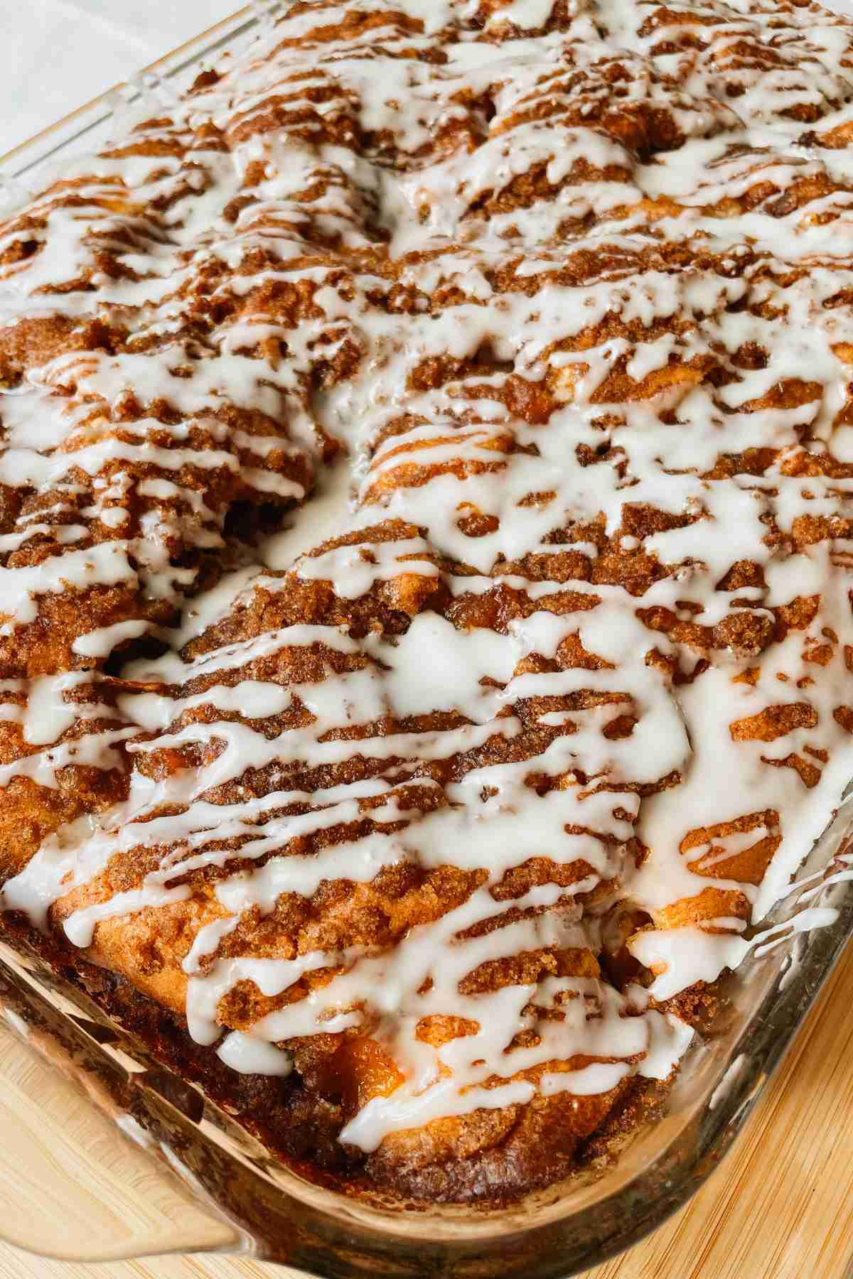 Sourdough peach coffee cake drizzled with vanilla glaze