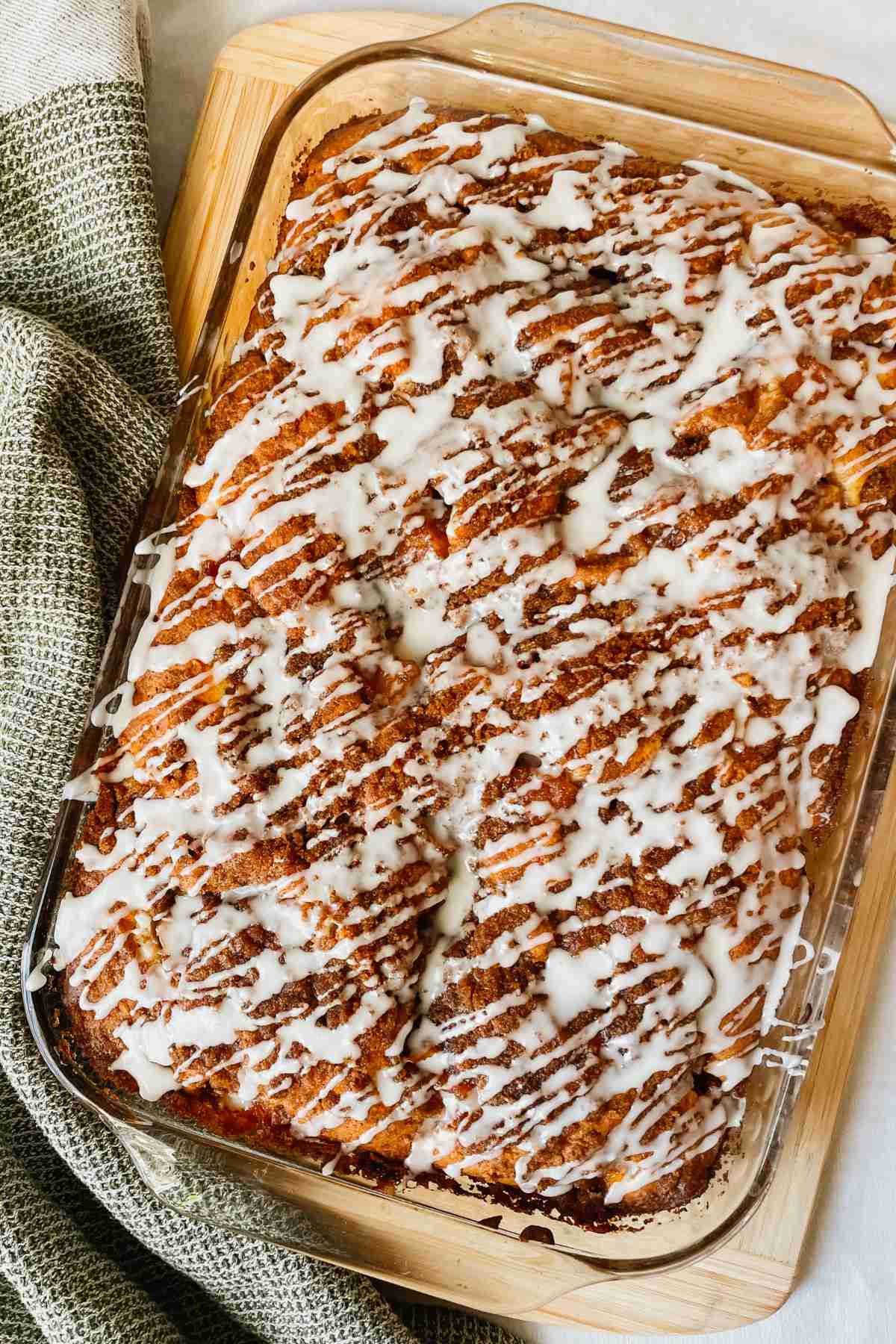 Sourdough peach coffee cake drizzled with vanilla glaze