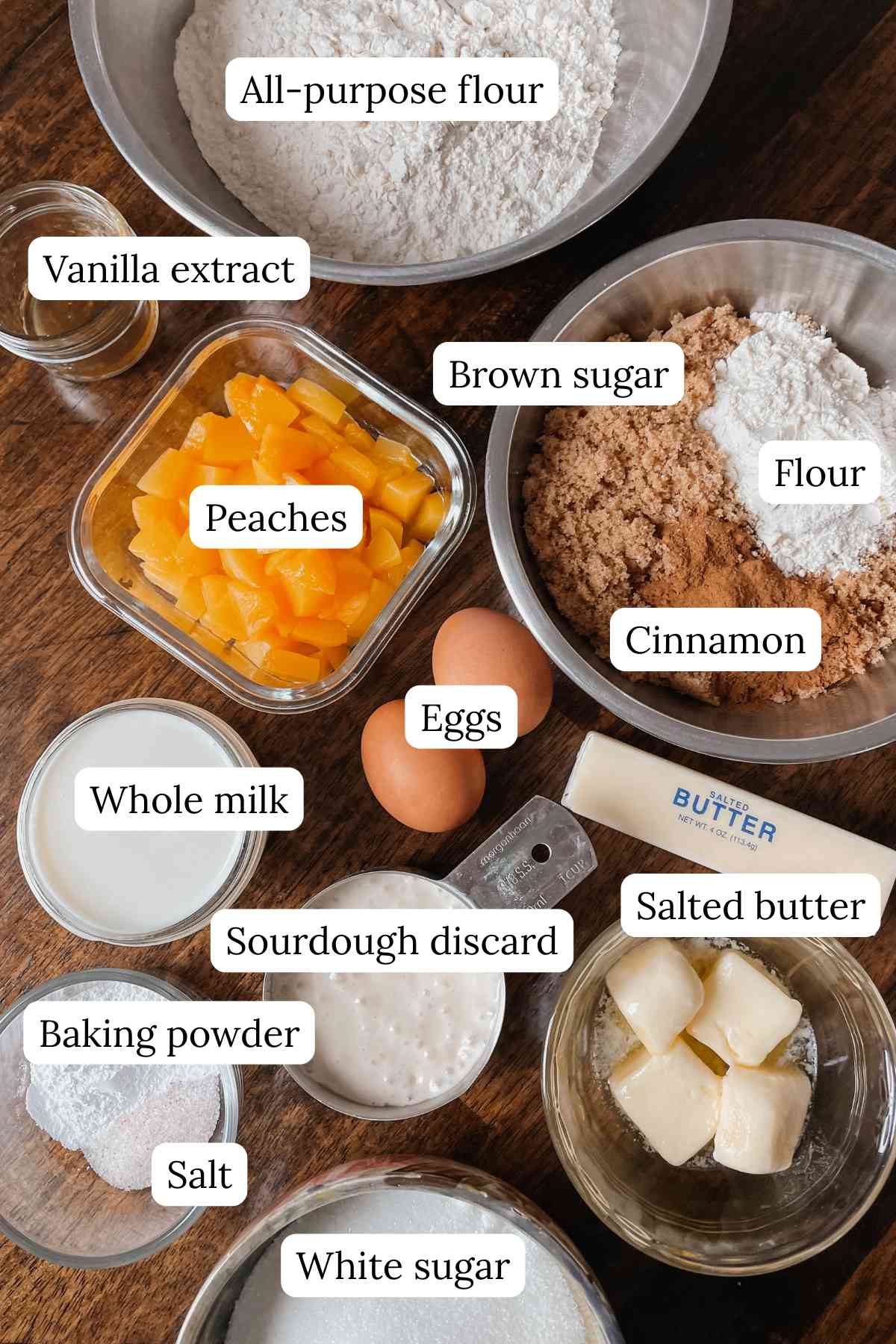 Sourdough peach coffee cake ingredients labeled on wooden table