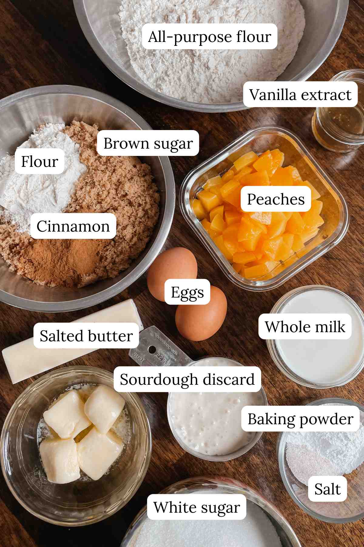 Sourdough peach coffee cake muffin ingredients labeled on wooden table