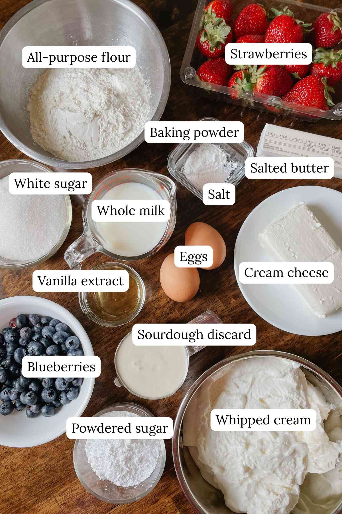 Sourdough American flag shortcake ingredients in bowls labeled on a wooden table