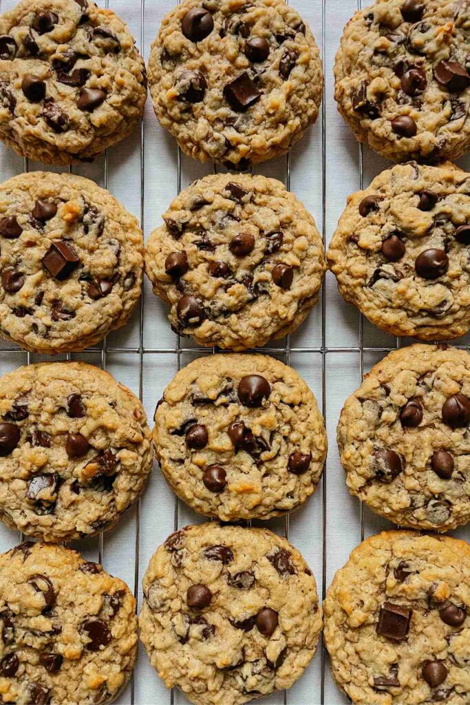 Sourdough peanut butter oatmeal chocolate chip cookies on wire rack