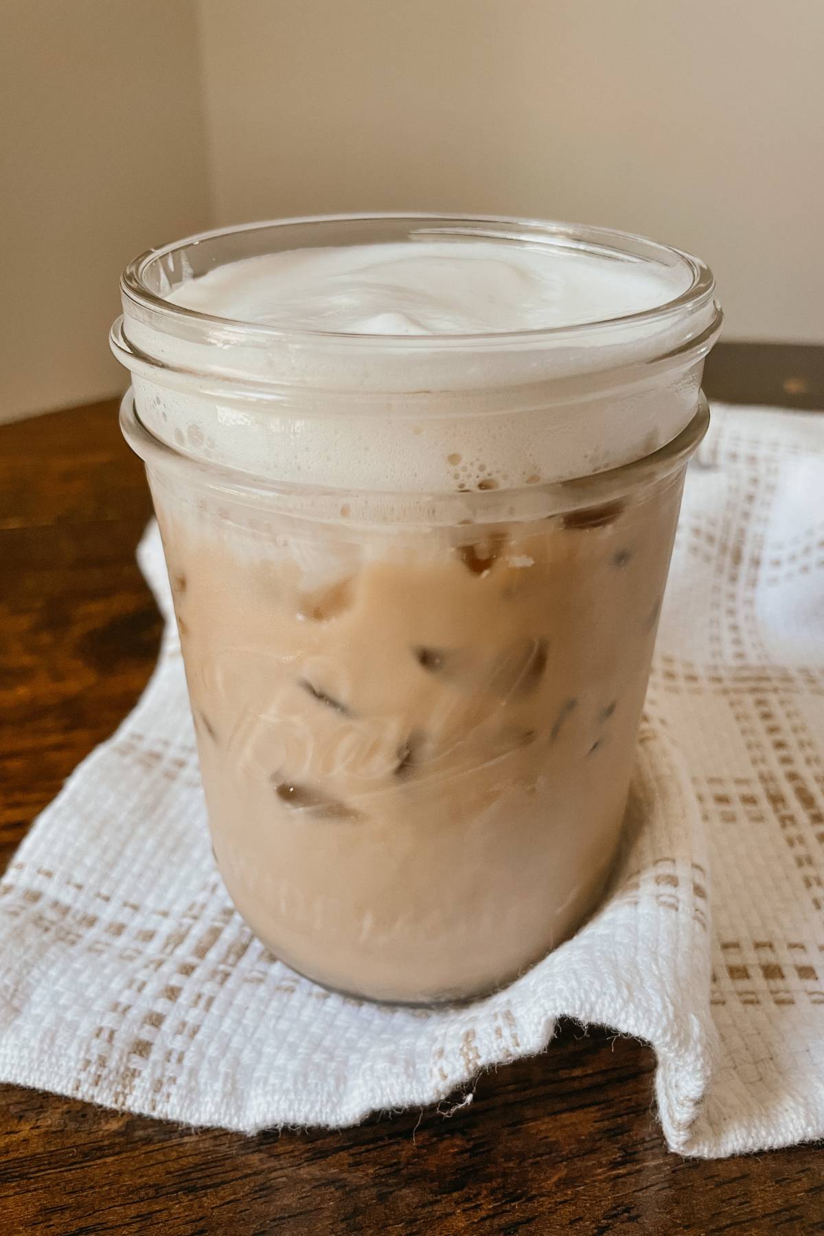 Mason jar of iced coffee with brown sugar coffee syrup