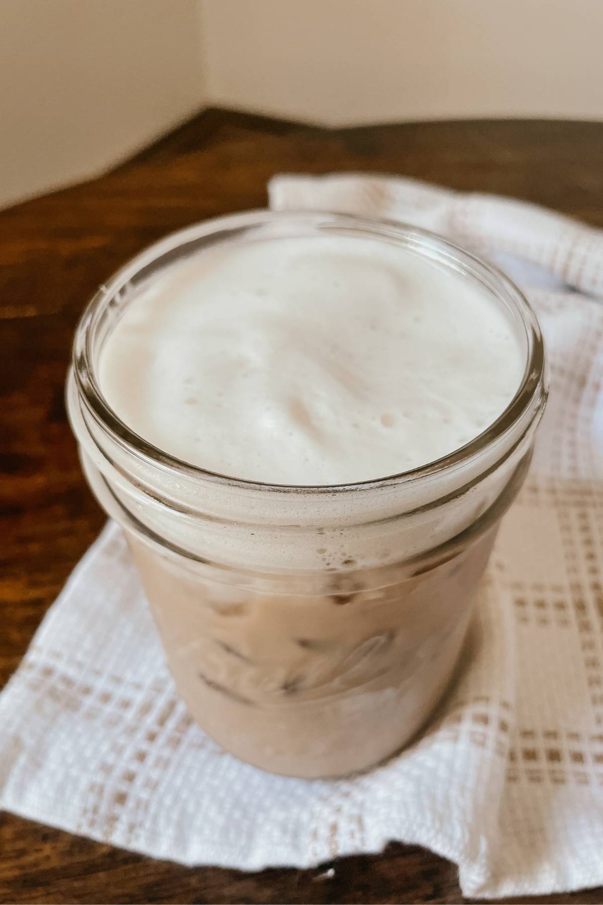 Mason jar of iced coffee with brown sugar coffee syrup