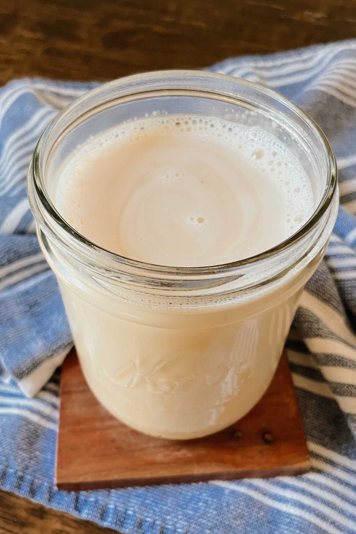 Close up of crème brûlée coffee syrup in a glass jar