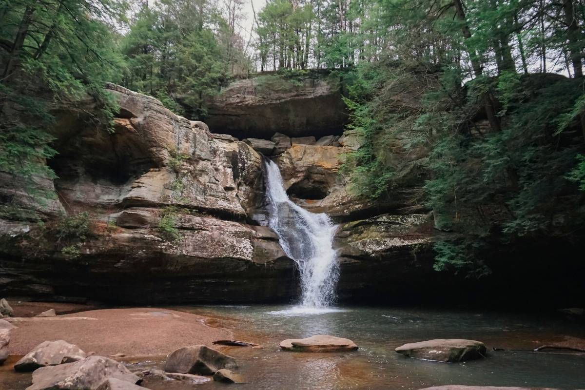 Waterfall flowing down rocks at Cedar Falls in Hocking Hills