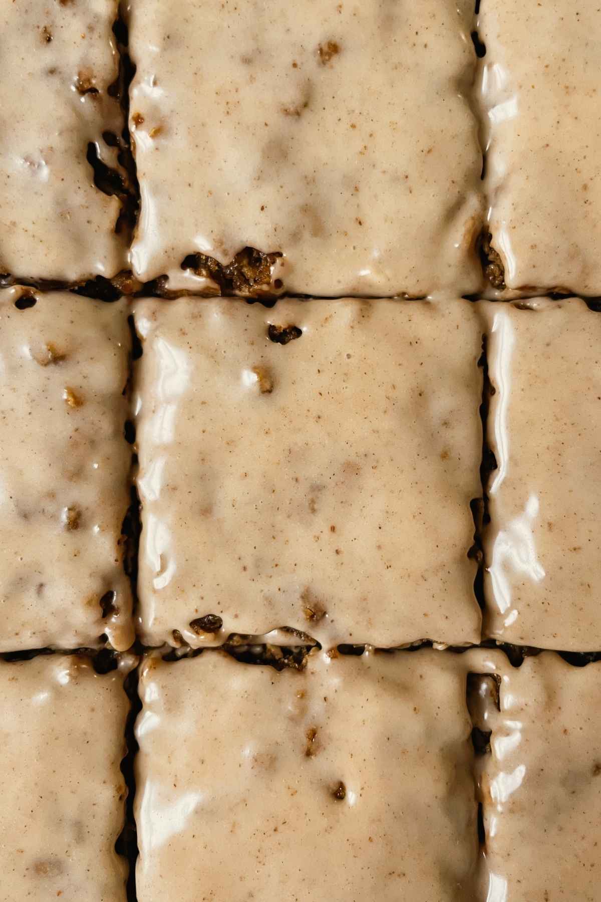 Sourdough gingerbread iced oatmeal cookie bar squares with maple cinnamon icing