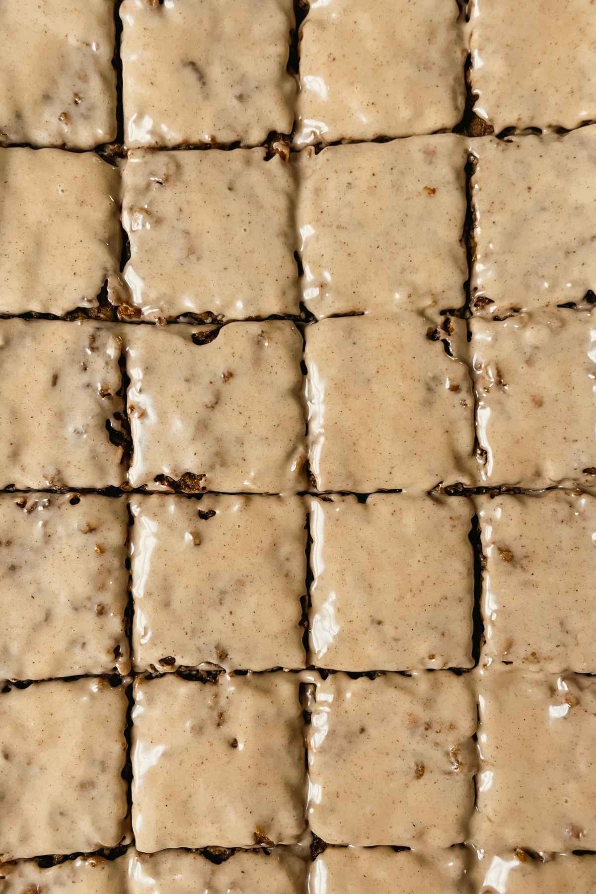 Sourdough gingerbread iced oatmeal cookie bar squares with maple cinnamon icing