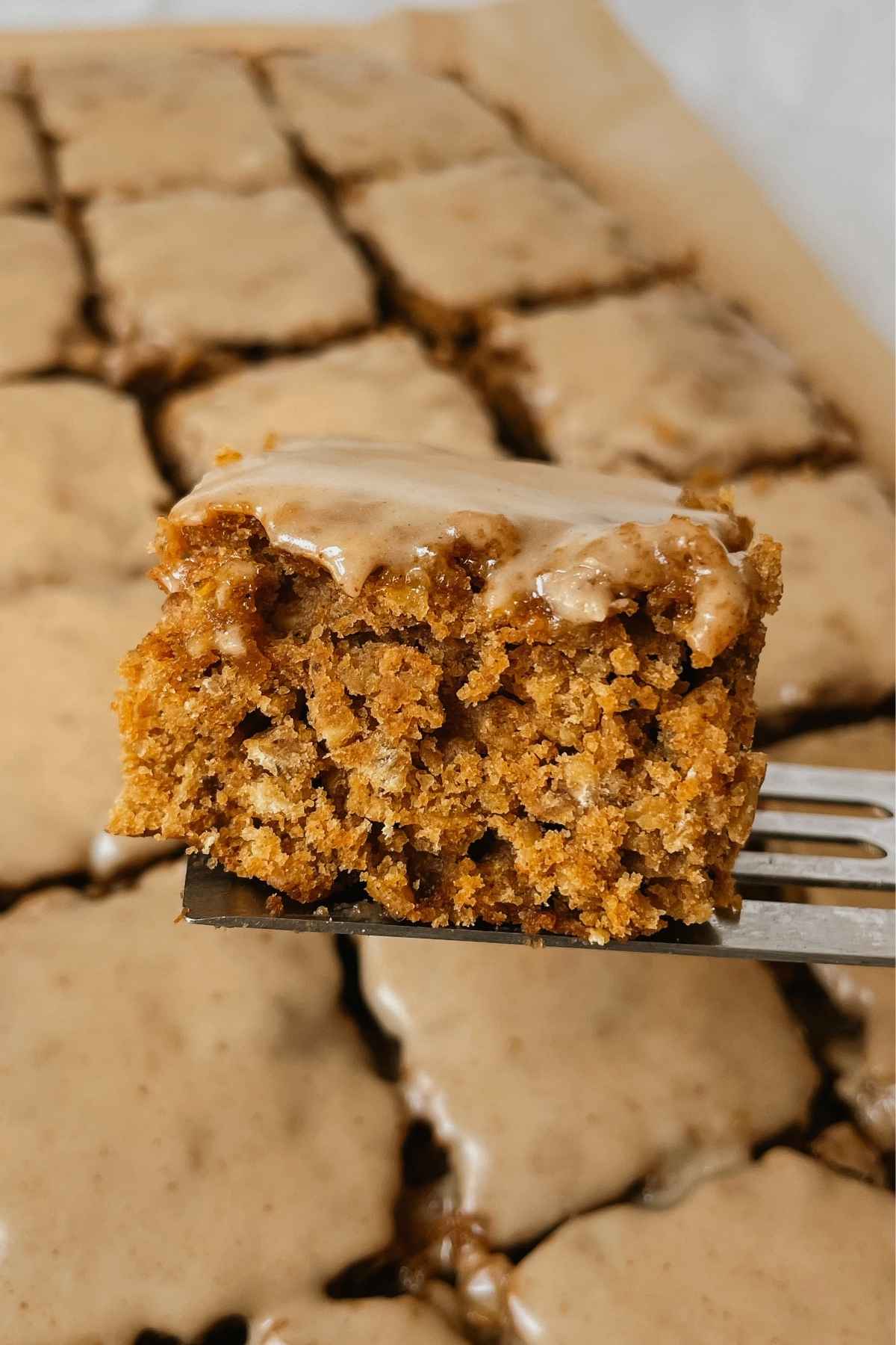 Sourdough pumpkin oatmeal cookie bar square held up on a square server